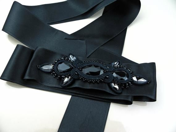 Black crystal sash, black belt for wedding dress, black satin belt for women, crystal belt, embroidered belt women, wedding belt ribbon.Hand embroidered belt with crystals on satin ribbon. An elegant accessory suitable for embellishing an evening dress or an unconventional wedding dress. Each of my creations is handmade after a careful study of shapes and colors. A unique piece created just for you!Length: 78.74 inchIt will be sent in a gift box.For any information do not hesitate to contact me! Elegant Adjustable Belt For Evening, Elegant Adjustable Sash For Formal Occasions, Elegant Black Belt For Evening, Elegant Adjustable Sashes For Formal Occasions, Elegant Formal Adjustable Sash, Elegant Formal Adjustable Sashes, Satin Ribbon Bridal Belt For Parties, Elegant Formal Bridal Belt With Ribbon, Elegant Ribbon Sashes As Gifts