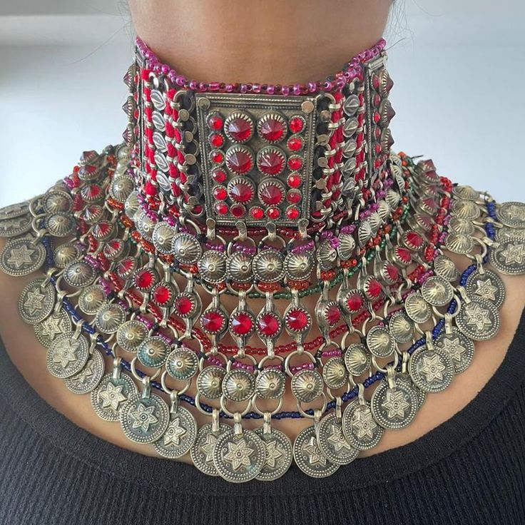 * This traditionally rich choker necklace belongs to the Tribe of Afghanistan - The Kuchi Tribe. The layers over layers falling on the neck are flaunting all the traditional vibe. The intricate work done by the local artisans, especially antique stones and coins dangling at the bottom are complementing the whole design. Pick it for your next traditional look and stand out among the crowd. Note: The product is handmade, so slight change might occur in the actual product. Oversized Necklace, Diamond Necklace Wedding, Handmade Chokers, Afghan Jewelry, Fabric Necklace, Eco Friendly Jewelry, Ethnic Jewelry, Vintage Jewellery, Earrings Handmade