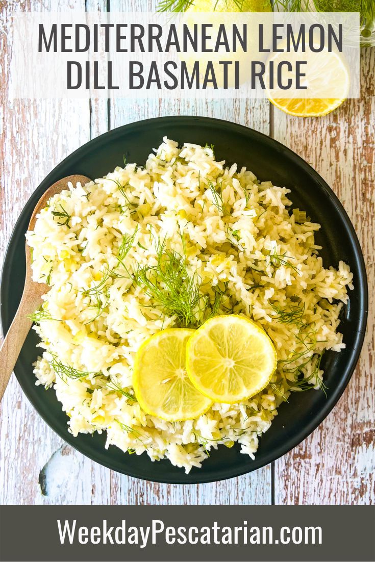 a black plate topped with rice and lemon wedges