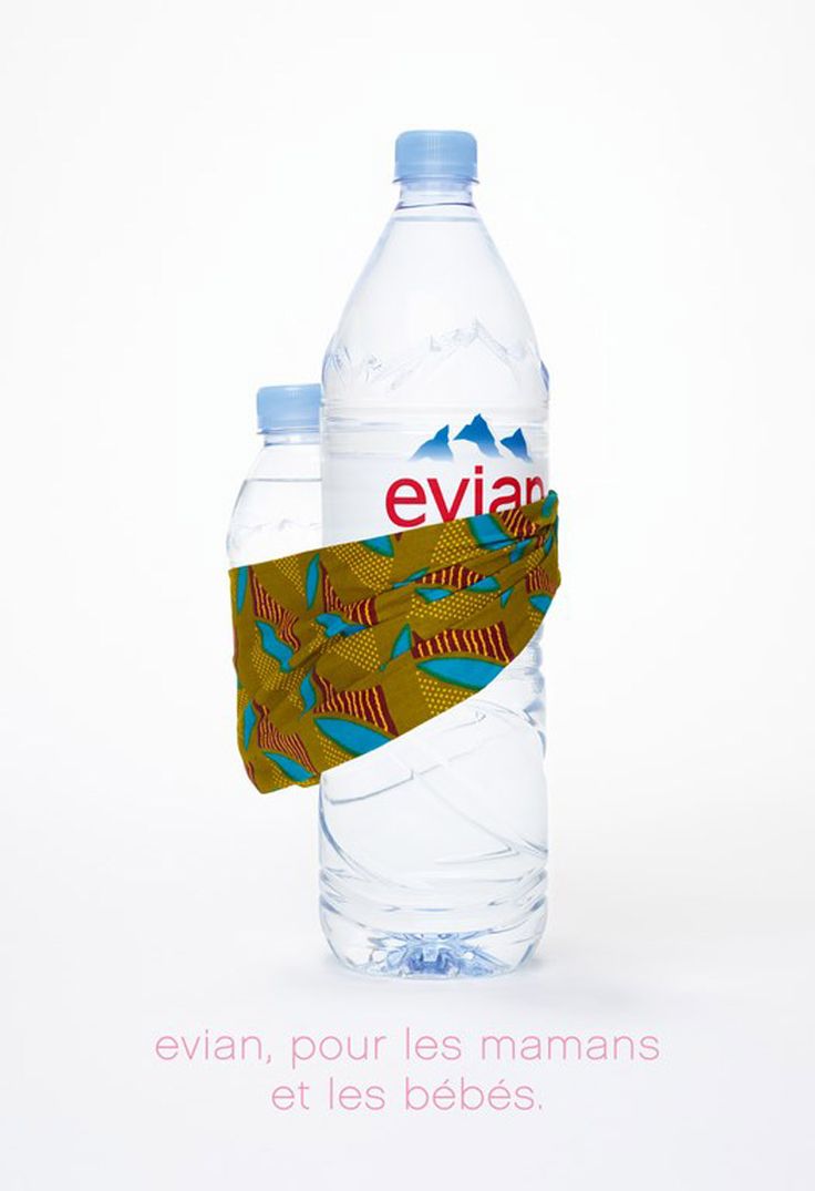 two water bottles with labels on them sitting next to each other in front of a white background