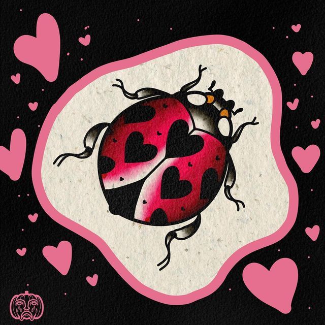 a ladybug with hearts on it's back