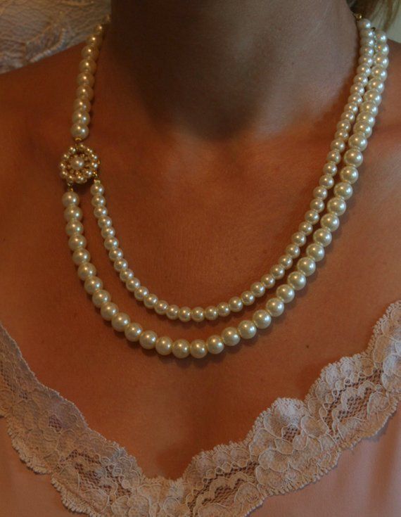 Dainty beautiful vintage style pearls bridal wedding necklace features golden flower filigree set with central Ivory genuine pearl surrounded with Swarovski clear rhinestone and curled hand beaded with cream Swarovski small pearls on a golden flower, connected with two strands of beautiful vintage Swarovski ivory pearls in two different sizes.In the and there is a golden clasp with extension golden chain. The shape is Victorian and fits so beautiful on your neck. A perfect necklace for the bride Classic Bridal Necklace For Wedding, Elegant Pearl Chain Bridal Necklace, Elegant Pearl Bridal Necklace For Wedding, Vintage Pearl White Wedding Jewelry, Elegant Pearl Charm Bridal Necklace For Wedding, Classic Pearl White Bridal Necklace For Wedding, Classic Gold Bridal Necklace For Wedding, Vintage Pearl Pendant Jewelry For Weddings, Classic Pearl Jewelry For Wedding