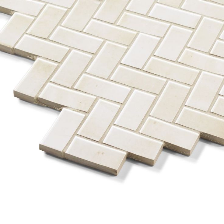 the white tile is laid on top of each other and looks like it has been made from