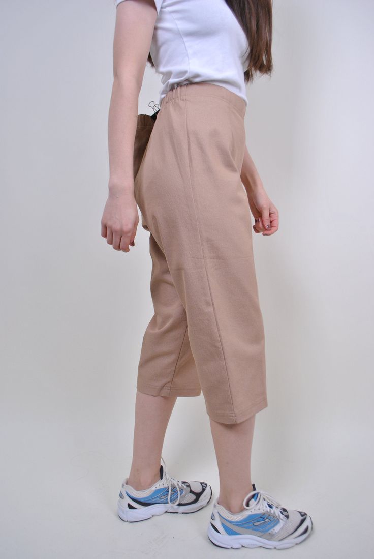 "90s beige chino capris, vintage women straight long shorts, Size W 34 Welcome to TARASCOMMON.ETSY.COM Unique clothing from the 20th century. Model tall 170cm. Size: FR/B - 44; Eur - 42; UK 16; Width - 39-49cm / 15.35-19.29inch; Length - 80cm / 31.49inch. All measurements are taken seam to seam while lying flat. Cotton. Polyester. This item is vintage, so it can have some defects. Additional photos can be send We are glad that you are interested in lots that we sell. Wish you a good shopping! FO Beige Capri Pants Outfit, Beige Stretch Capris For Spring, Stretch Beige Capris For Spring, Spring Beige Stretch Capris, Cream Knee-length Bottoms For Summer, Beige Knee-length Shorts For Work, Chic Knee-length Cotton Bottoms, Beige Knee-length Bottoms For Spring, Casual Beige Knee-length Bottoms