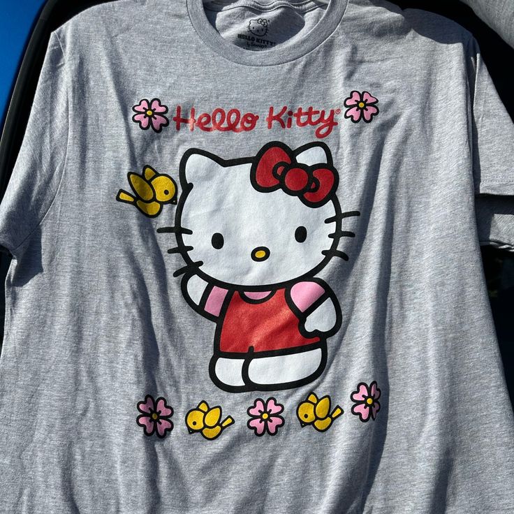 Hello Kitty By Sanrio T-Shirt Size Large Brand New Hello Kitty Fun Crew Neck Top, Hello Kitty Crew Neck Fun Tops, Hello Kitty Kawaii T-shirt For Spring, Kawaii Hello Kitty T-shirt For Spring, Spring Kawaii Hello Kitty T-shirt, Playful Hello Kitty T-shirt For Spring, Hello Kitty Graphic Crew Neck Top, Hello Kitty Graphic Crew Neck Tee, Fun Hello Kitty Print Summer T-shirt