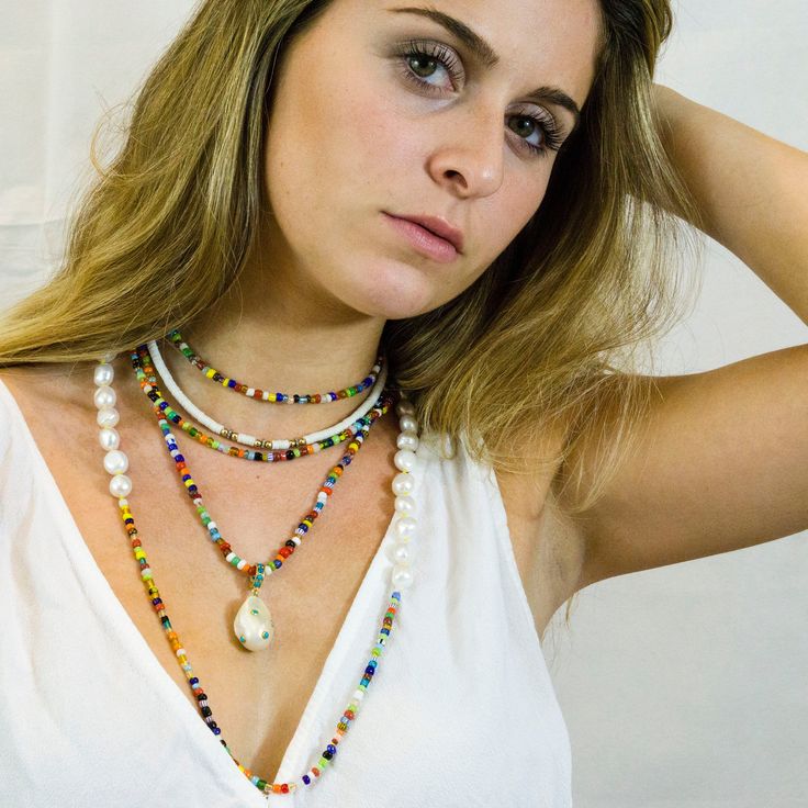 "Bright, vibrant beads make this necklace perfect addition to your summer sundress or a white blouse. African glass beads and white freshwater pearls are hand knotted along the silk cord to create a colorful and bright strand. Alone or layered with your favorites, this necklace exudes a playful, eclectic bohemian elegance. Necklace: 43\" Layer this necklace with: https://www.etsy.com/listing/637252353/baroque-pearl-and-turquoise-necklace?ref=shop_home_active_2 You might also like: https://www.et Adjustable Pearl Charm Necklace For Vacation, Pearl Chain Necklace For Beach, Adjustable Pearl Charm Necklaces For Vacation, Summer Beach-appropriate Pearl Chain Necklace, Bohemian Pearl Charm Necklace For Vacation, Bohemian Necklace With Pearl Charm For Vacation, Bohemian Beach Jewelry With Pearl Chain, Bohemian Pearl Chain Necklace For Beach, Bohemian Pearl Charm Jewelry For Vacation