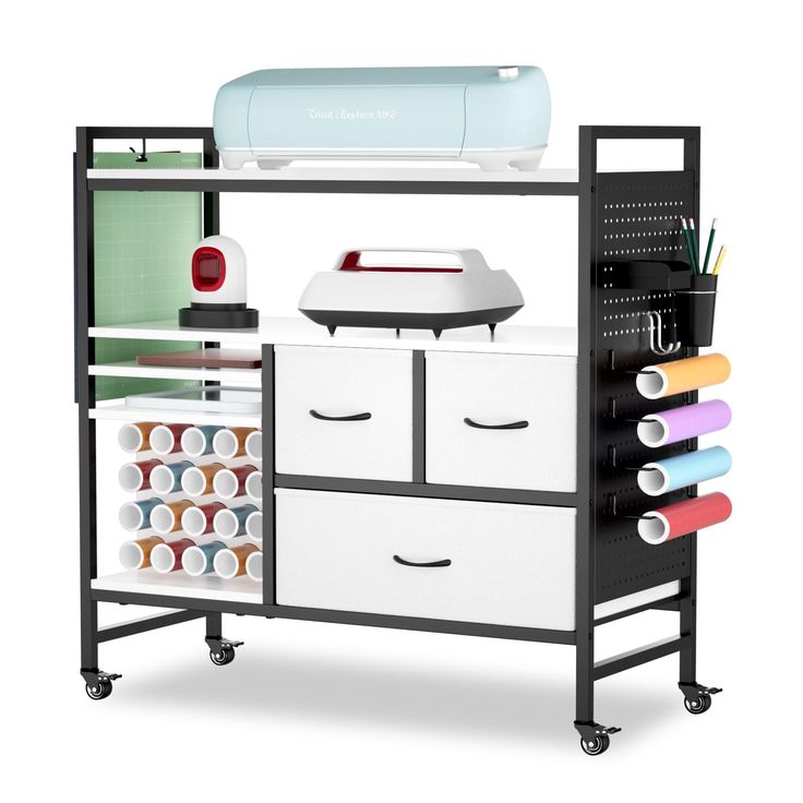 an ironing board and sewing machine on wheels with craft supplies in the bottom drawer