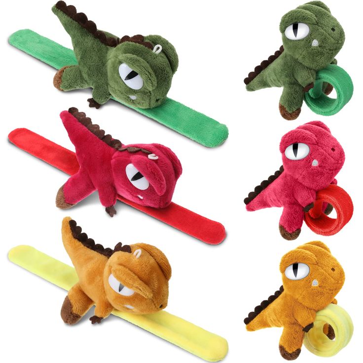 four different colored alligator hair clips in the shape of toothbrushes with googly eyes