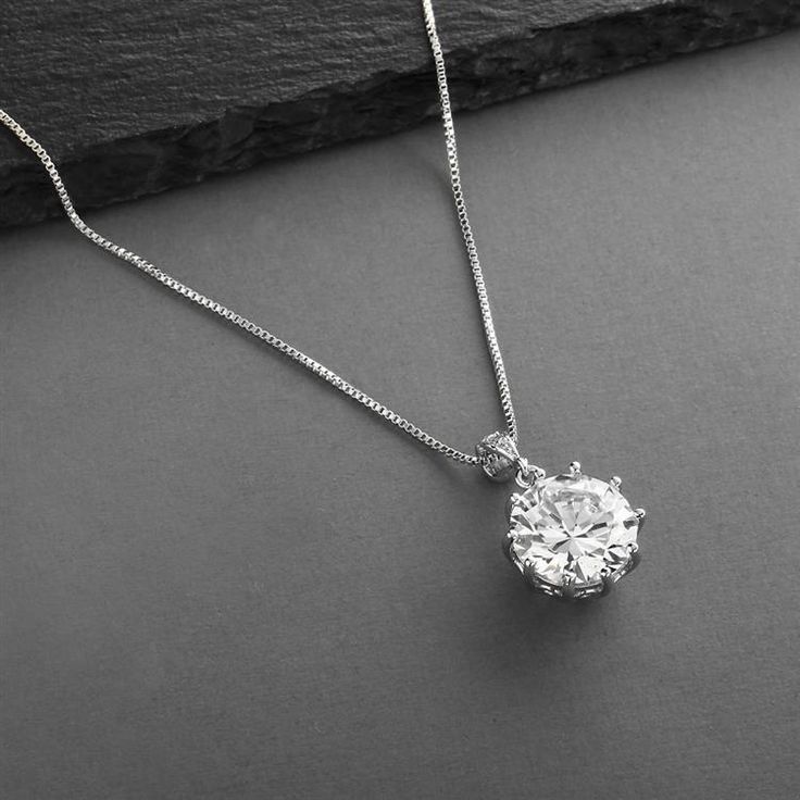 Bridal, Prom or Bridesmaids Bling CZ Necklace Pendant This 1/2" round 5 Ct. Cubic Zirconia Pendant has the brilliance of a genuine diamond! Our CZ is set in Genuine Rhodium for the look of Platinum. Brides, bridesmaids, mothers of the brides & prom girls will turn heads in this 16" - 19" adj. necklace. Womens Necklaces Silver, Silver Bridal Jewellery, Round Diamond Pendant, Long Statement Earrings, Crystal Wedding Jewelry, Bridesmaid Pearls, Pearl Bridal Jewelry, Necklaces Silver, Pearl Jewelry Wedding