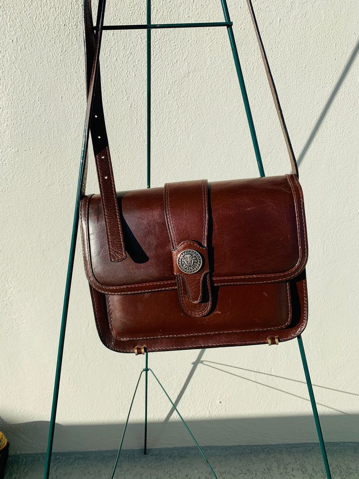 "Vitello men's shoulder bag Genuine leather brown purse Vintage bag Gift for men Men's leather bag Brown genuine leather shoulder bag Gift for him Good vintage condition. Measurements: 10\" X 8\" X 4\" Strap: 42\" Adjustable Picture's colors may appear slightly different based on the monitor's setting." Classic Brown Shoulder Bag With Coin Pocket, Vintage Brown Saddle Bag For Business, Brown Shoulder Bag With Coin Pocket For Business, Rectangular Brown Shoulder Bag For Everyday, Brown Rectangular Shoulder Bag For Everyday, Everyday Shoulder Bag With Coin Pocket, Brown Shoulder Bag With Coin Pocket For Travel, Vintage Leather Shoulder Bag For Everyday, Vintage Crossbody Shoulder Bag For Everyday Carry