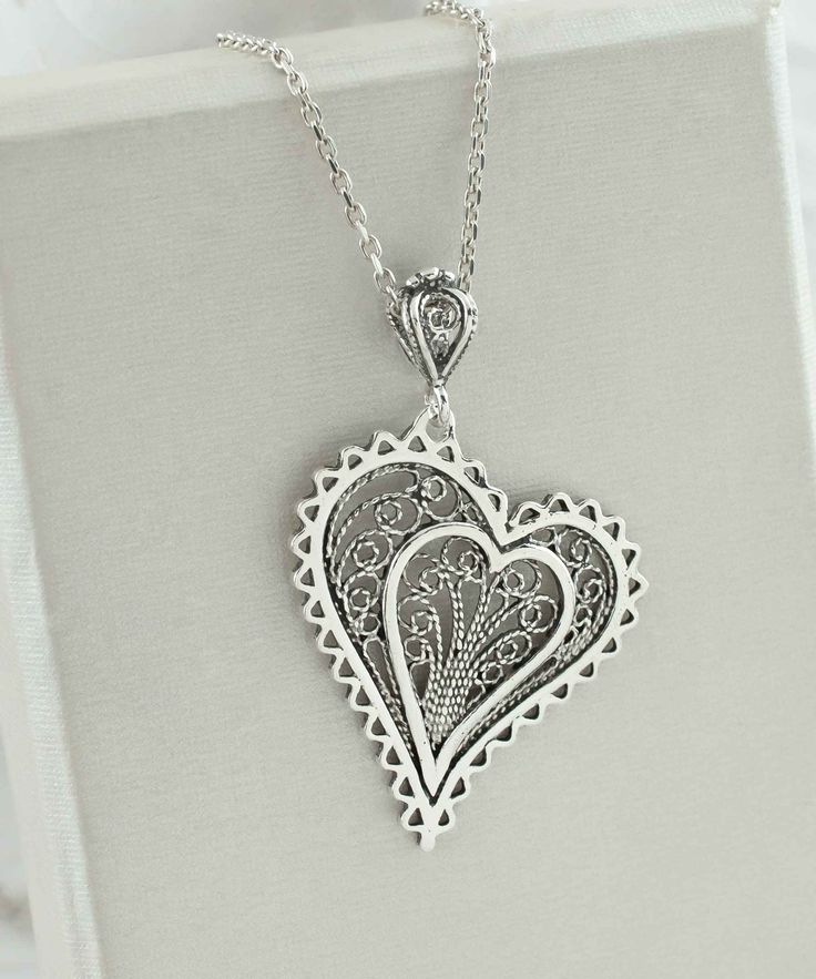 Introducing our Handcrafted Filigree Art Asymmetric Heart Figured Women's Silver Pendant Necklace! This stunning piece features a unique design with an asymmetric heart-shaped pendant, measuring 1.65 inches in height and 1.05 inches in width, suspended from a 20-inch silver chain. Expertly crafted with filigree art, this necklace is a beautiful addition to any jewelry collection. It comes with a silver polish cloth and a luxurious gift box, making it the perfect gift option for Mother's Day, ann Vintage Heart Shaped Jewelry With Large Pendant, Elegant Filigree Heart Necklace, Vintage Heart-shaped Jewelry With Large Pendant, Teardrop Pendant Necklace With Intricate Design For Gift, Intricate Teardrop Pendant Necklace As Gift, Unique Heart Pendant Wedding Jewelry, Elegant Heart-shaped Filigree Necklace, Unique Heart Pendant Jewelry For Wedding, Elegant Heart Shaped Filigree Necklace