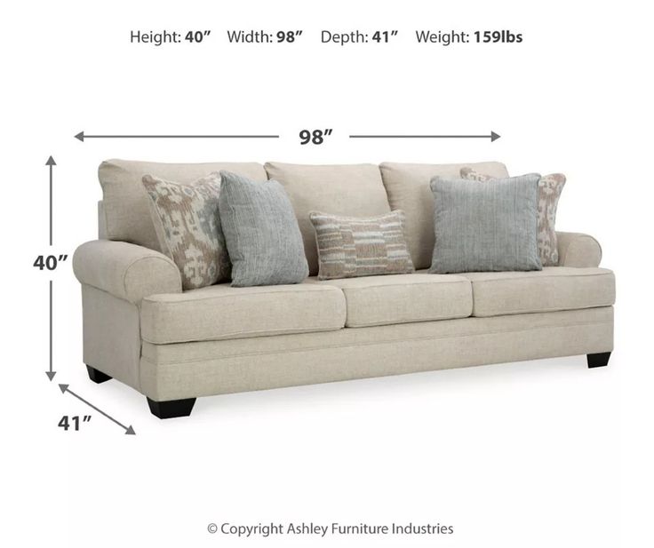 a couch with pillows and measurements for it