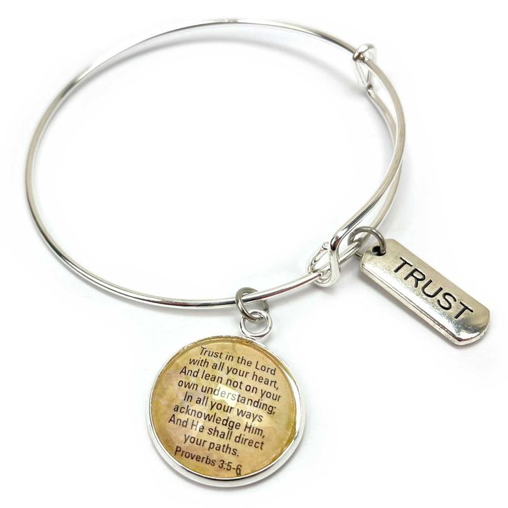 Our Word+Scripture charm bangle collection features bracelets with one or two dangling Christian affirmations charms. Choose one of 19 silver word charms and add a beautiful glass charm with a coordinating scripture verse. Scripture bangle bracelets make great Confirmation, birthday, and graduation gifts. ENOUGH: And God is able to bless you abundantly, so that in all things at all times, having all that you need, you will abound in every good work. –2 Corinthians 9:8FAITH: Now faith is confidence in what we hope for and assurance about what we do not see. –Hebrews 11:1FAMILY: But as for me and my house, we will serve the LORD. –Joshua 24:15FEARLESS: God is within her, she will not fall. –Psalm 46:5FOREVER: Give thanks to the Lord, for He is good. His love endures forever. –Psalm 136:1 The Inspirational Jewelry For Friendship, Meaningful Faith-inspired Bracelet Jewelry, Meaningful Adjustable Charm Bracelet, Inspirational Friendship Bracelet Jewelry, Inspirational Personalized Adjustable Charm Bracelet, Personalized Inspirational Adjustable Charm Bracelet, Inspirational Adjustable Personalized Charm Bracelet, Personalized Adjustable Inspirational Charm Bracelet, Inspirational Nickel-free Metal Jewelry