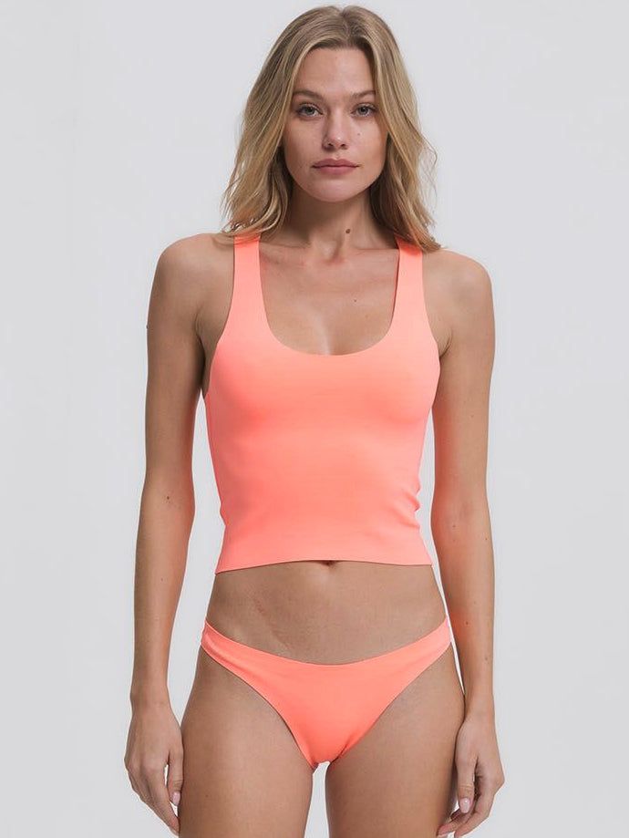 The Racer Back Top, modeled after a sports bra, provides good support and an elegant style that works as well on the beach as off. It pairs well with any of our bottoms but we particularly love it with our Classic Bottom. It's part of our neoprene swimwear collection that uniquely form fits to the body without digging in. It is colorful and bold, yet timeless and classic and creates a second skin when wet and molds to your body in all the right places. Neoprene sizing is very flexible and many s Neoprene Swimwear, Ddd Cup, Bandeau Top, Swimwear Collection, Racer Back, Second Skin, Elegant Style, Body Shapes, The Beach