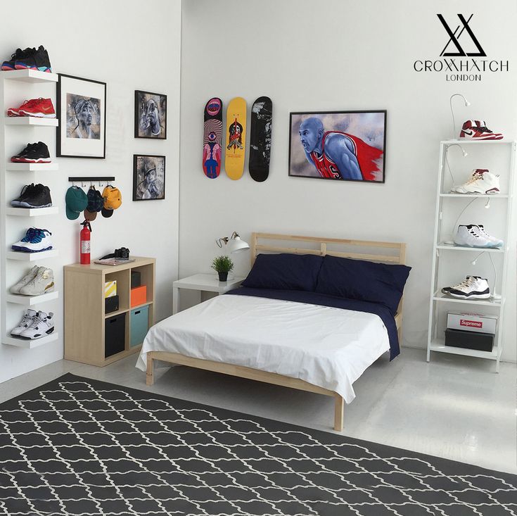 a bed sitting in a bedroom next to a shelf filled with shoes