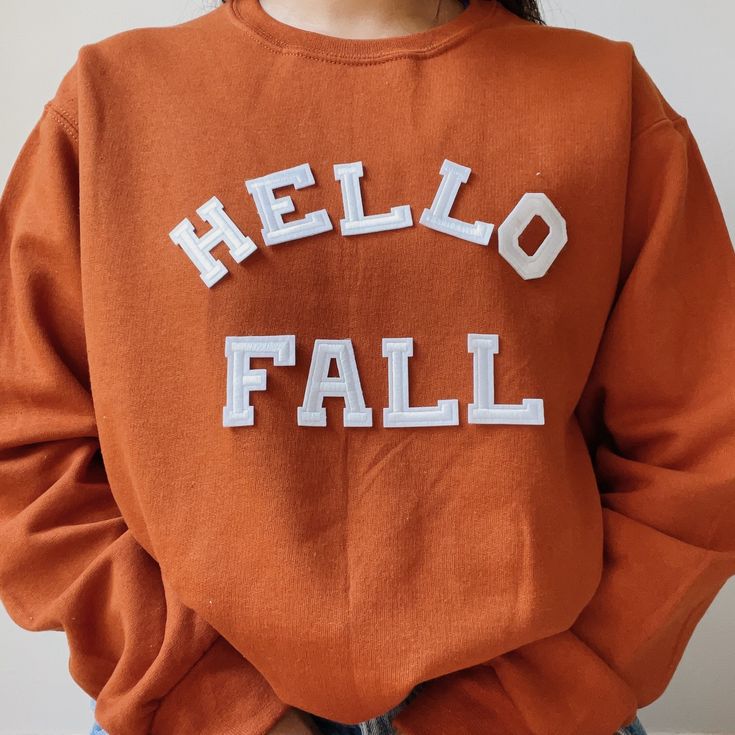 "This fall sweatshirt is perfect to lounge this cozy cuddle fall season! It is also a great gift to your loved ones who loves fall season or halloween! - Model is 5\"3 is wearing size Large in the photos - Please keep in mind the letters are patches that are heat pressed, NO embroidered. - All our sweatshirts run a UNISEX fit. They are naturally oversized, but if you want a more baggy look then size up! - Material is super soft and comfy! ♡ - Please note that crewneck brand used may vary dependi Fall Sweatshirt Vinyl Simple, Cheap Fall Sweatshirt With Cartoon Print, Cheap Heart Graphic Sweatshirt For Fall, Fall Text Print Sweatshirt, Cheap Fall Hoodie For College, Affordable Fall Hoodie For College, Cheap Fall Sweatshirt For Gift, Cheap Orange Sweatshirt For Fall, Affordable Fall Sweatshirt For Sports Fans