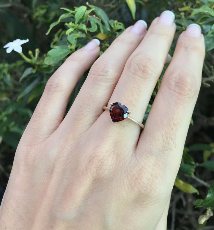 "A romantic Heart-Shaped genuine faceted Red Garnet prong set on a tapered band handcrafted in your choice of metal such as Silver, Rose Plated Silver, Gold Plated Silver. Add your Personalize touch by Engraving the Ring with a Memorable Message, Max 12 Letters.. This beauty makes a great Birthstone Ring for those January Birthday gals! Wrapped in a box ready for gift-giving.(r-265) Ring Info --------------------- *Genuine Heart-Shaped Garnet measures 8mm; Can be made with other stones *Silver, Pear-shaped Promise Rings For Valentine's Day, Pear-shaped Jewelry For Valentine's Day Anniversary, Valentine's Day Pear-shaped Fine Jewelry Rings, Valentine's Day Pear-shaped Fine Rings, Red Heart-cut Jewelry For Anniversary, Pear-shaped Jewelry For Valentine's Day Gift, Red Heart Cut Jewelry For Anniversary, Valentine's Day Gift Pear-shaped Jewelry, Classic Solitaire Jewelry For Valentine's Day