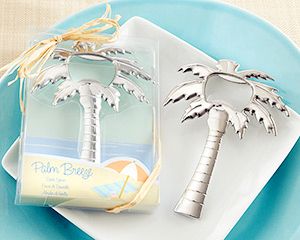 a palm tree bottle opener sitting on top of a blue plate next to a napkin