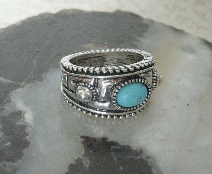 Turquoise Ring This lovely silver plated ring has a turquoise setting and beautiful engraved design. Size 9. Bohemian Silver Turquoise Ring With Stone Setting, Bohemian Turquoise Ring With Stone Setting, Silver Bohemian Turquoise Ring With Stone Setting, Bohemian Silver Concho Rings, Silver Bohemian Concho Rings, Silver Western Rings, Western Ring, Western Rings, Bohemian Cowgirl