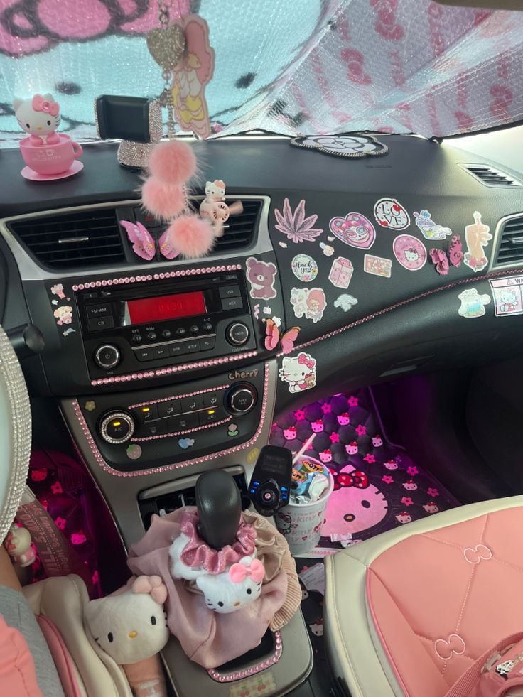 the interior of a car decorated with hello kitty decorations