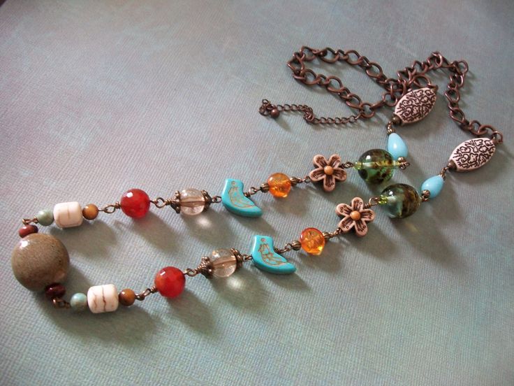 "This one of a kind necklace measures 29\" inches in length and has an extender to lengthen the necklace. The chain is brass as well as the brass wire wrapping throughout the necklace. I have used turquoise beads, glass beads, tiger eye beads, carnelian beads, ceramic beads, howlite beads, resin plastic beads, brass beads and brass findings. Gift box included." Bohemian Wire Wrapped Beaded Necklaces With Czech Glass, Bohemian Czech Glass Beaded Necklace With Wire Wrap, Bohemian Wire Wrapped Czech Glass Beaded Necklace, Bohemian Czech Glass Wire Wrapped Beaded Necklace, Bohemian Czech Glass Bronze Necklace, Bohemian Beaded Chain Copper Necklaces, Bohemian Copper Beaded Chain Necklaces, Bohemian Copper Necklace With Beaded Chain, Turquoise Beaded Chain Long Necklace In Bohemian Style