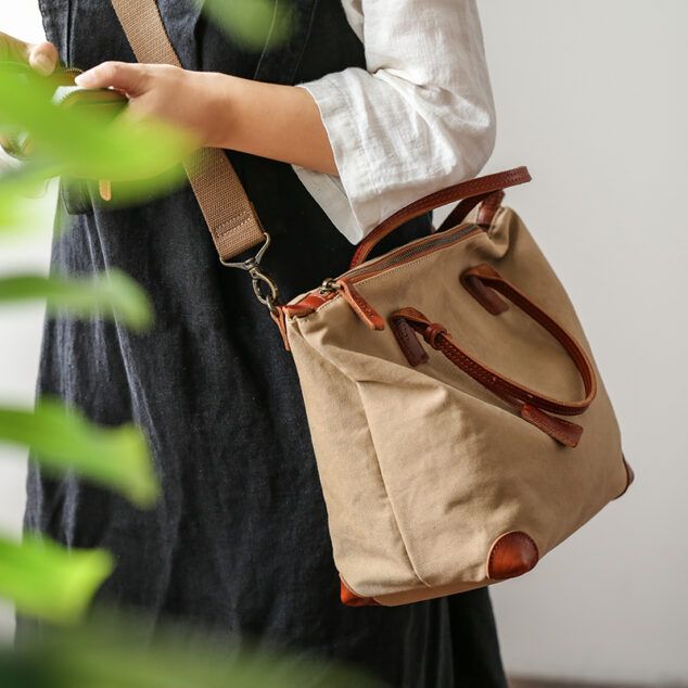 Eny Cotton Canvas Tote bag With Vegetable Tanned Leather Trim | Peili Casual Brown Cotton Satchel, Brown Satchel With Canvas Lining For Everyday Use, Cotton Shoulder Bag With Zipper For On-the-go, Brown Canvas Satchel Bag, Brown Cotton Satchel Canvas Bag, Casual Beige Bag With Waxed Finish, Brown Cotton Shoulder Bag With Leather Trim, Cotton Satchel With Zipper For Daily Use, Daily Use Cotton Satchel With Zipper Closure