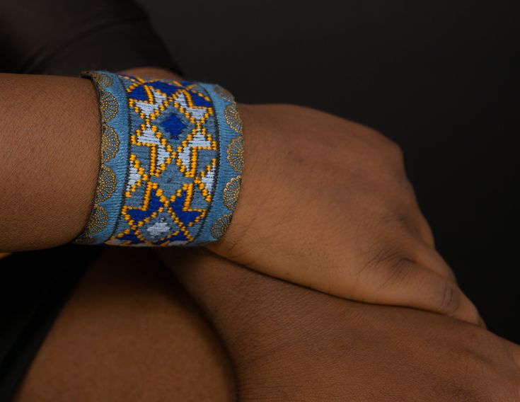 Geometric Cuff Embroidered Bracelet for Women, Textile Blue Background, Boho Bracelet, Bracelet for Women Stylish bracelet with soothing color of Blue that you can easily match with your outfit. It will surely add to your style. The bracelet is hand made needle work with 100% natural thread, all environmentally friendly material (100% cotton and brass, NO plastic) for people that we share our concern about environment with. One item takes days and days of needlework. The artistic patterns inspir Adjustable Woven Blue Bracelets, Adjustable Blue Woven Bracelets, Adjustable Blue Woven Bracelet, Blue Woven Friendship Bracelets For Festivals, Blue Woven Bracelets As Gifts, Blue Woven Bracelets As A Gift, Handmade Blue Cuff Bracelet, Blue Woven Bracelet Perfect For Gifting, Blue Woven Bracelet Perfect For Gift