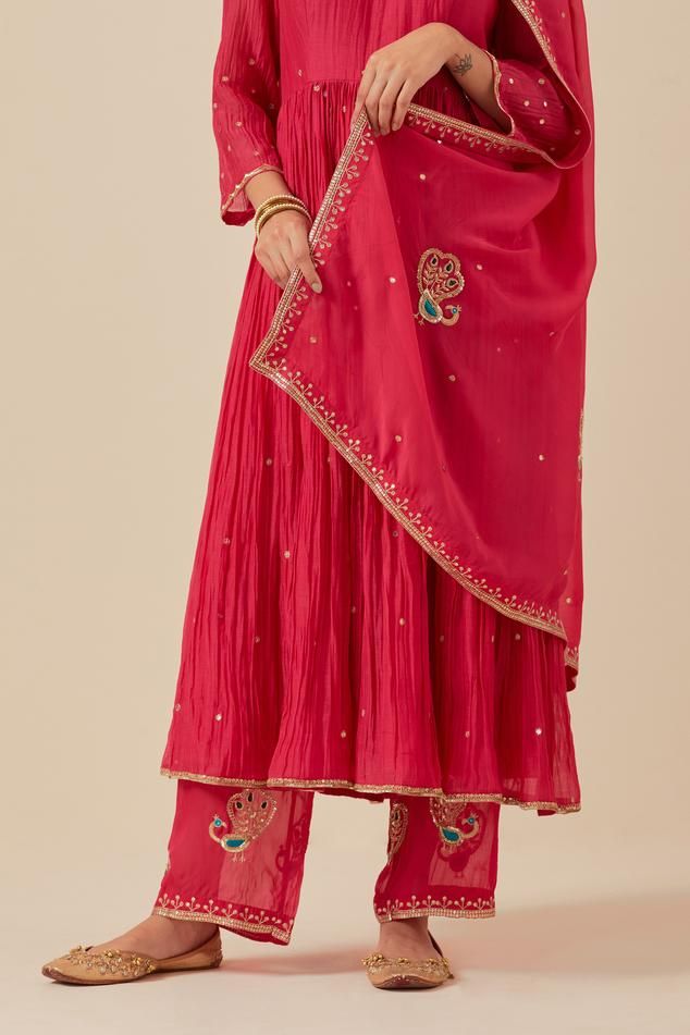 Pink anarkali with sequin hand embroidery and gathered detail. Paired with embroidered pant and embroidered dupatta.
Components: 3
Pattern: Embroidered
Type Of Work: Sequin
Neckline: Scoop
Sleeve Type: Sheer
Fabric: Anarkali and Pant: Chanderi, Dupatta: Tissue Organza
Color: Pink
Other Details: 
Weight: 2 kgs
Length:
Anarkali: 47 inches
Pant: 37 inches
Model is wearing size S
Pant Closure: Elasticated back
Occasion: Puja - Aza Fashions Pink Anarkali, Chanderi Dupatta, Embroidered Pants, Pant Set For Women, Embroidered Dupatta, Sheer Fabric, Hand Work, Pant Set, Sheer Fabrics