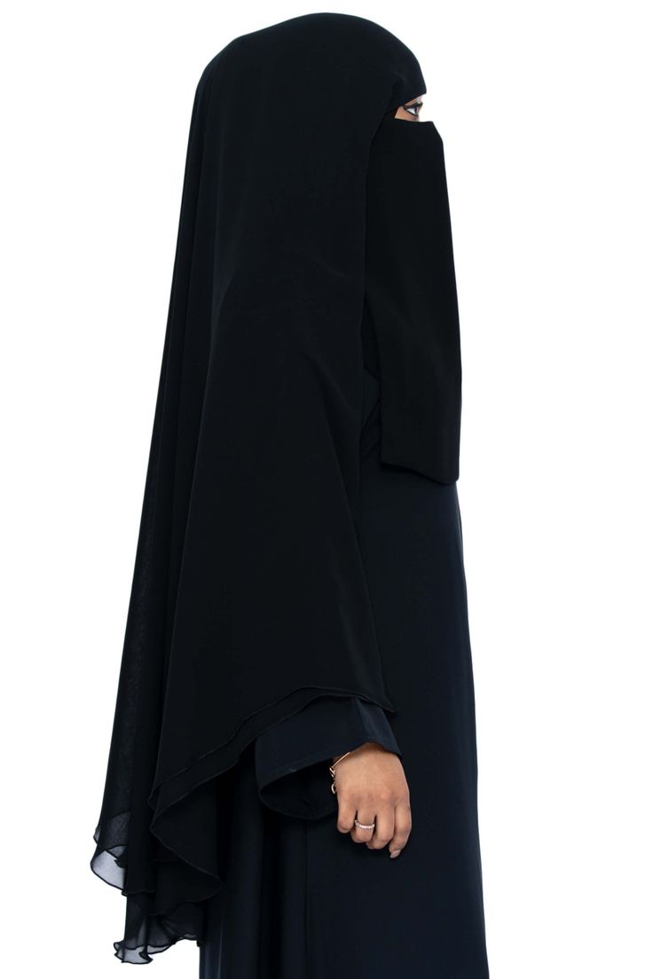 Simple and elegant is how we describe our Muhessa Niqab. Made with 2 layers of soft chiffon and draping a full 45 inches, Muhessa is designed for modesty and simplicity. Free from stones and embellishments, Muhessa is your choice for creating a look of piety and modesty. Pair Muhessa with your favorite Classic Black abaya for a classy, understated look. Made with luxuriously soft chiffon Long Niqab 45" inches Plain niqab without stones Abaya not included Made in Dubai Elegant Long Niqab For Eid, Elegant Maxi Length Niqab For Eid, Niqab Colors, Luxury Black Elegant Niqab, 3 Layer Niqab, Black Abaya, Garment Workers, Niqab, In Dubai