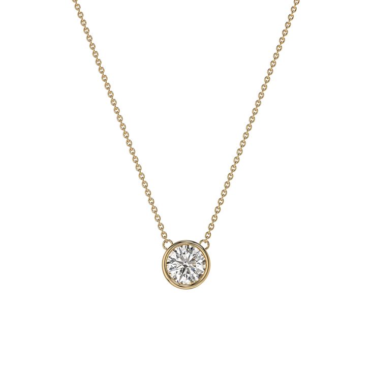 Introducing our Bezel Round Moissanite Diamond Pendant, available in 1 CT or 2 CT, plated in 18K White, Yellow, and Rose Gold. This pendant is the epitome of elegance, featuring a brilliant moissanite diamond in a modern bezel setting. It's a perfect gift for any occasion, adding timeless sophistication to any outfit. Necklace Details: » Necklace Length: 16 Inches + Adjustable 2 Inches » Stone Size: 1 CT [6.5MM] or 2 CT [8MM] » Base Metal: Solid Genuine 925 Sterling Silver » Color: 18K White, Ye Classic Diamond Necklace With Round Single Diamond, Classic Diamond Necklace With Single Round Stone, Classic Round Cut Diamond Necklace With Bezel Setting, Classic Round Stone Diamond Necklace, Classic Yellow Gold Diamond Necklace With Round Stone, Classic Pendant Diamond Necklace With Bezel Setting, Classic Solitaire Necklace With Bezel Setting, Classic Bezel Set Round Diamond Necklace, Classic Diamond Necklace For Anniversary With Bezel Setting