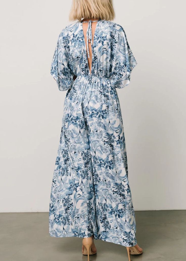 Indulge in effortless style this summer with our Bohemian Blue Print Jumpsuit. Crafted from premium cotton, this jumpsuit features a stunning blue print, lace up detailing, and convenient pockets. Perfect for warm weather, it's a must-have addition to your wardrobe for a sophisticated and exclusive look. Fabric: Cotton BlendedSize & Fit:Fit: This garment fits true to size.Length: Size L measures 50.7"from shoulder to hemBust: Great for any cup size. Waist: Loose Fit. Comfortable room throughout midsection.Hip: Loose Fit - room for hips.Hand Wash Cold.