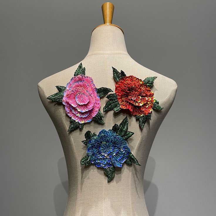 a white mannequin with colorful flowers on it