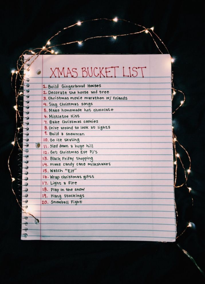 a christmas bucket list with lights around it