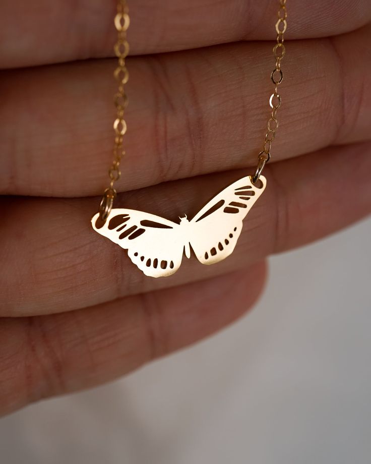 Our Metamorphosis Butterfly Necklace is the perfect accessory to transform any outfit! Crafted with either 18k Gold or Sterling Silver, this customizable necklace features a butterfly design that you can engrave with two initials for a personalized touch! NECKLACE FEATURES Choice of material: Solid High-Quality .925 Sterling Silver. Finish: 18k Gold or Sterling Silver Cable chain is sterling silver or 14K gold filled. Choose to engrave the butterfly with two initials, or leave it blank for a sle Minimalist Butterfly Charm Jewelry Gift, Minimalist Butterfly Charm Jewelry Gift For Her, Gold Jewelry With Butterfly Charm For Gift, 14k Gold Butterfly Jewelry For Gifts, Minimalist Butterfly Charm Jewelry As A Gift, Butterfly Charm Jewelry As Gift For Her, Gold Jewelry With Butterfly Charm For Her, Everyday White Butterfly Jewelry, Butterfly Necklace With Adjustable Chain For Gift