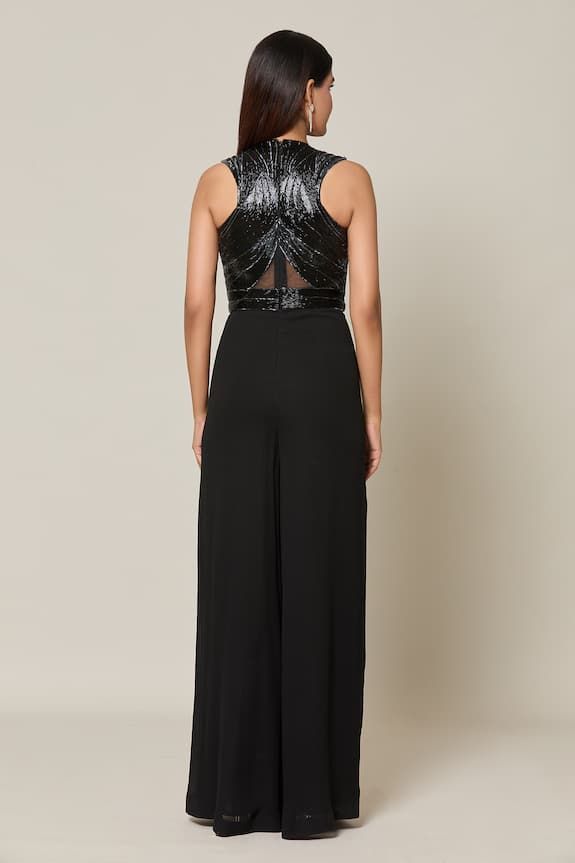 Black sleeveless halter neck jumpsuit with tonal nalki embellishments on the bodice and semi sheer detailing. - Aza Fashions Glamorous Strapless Sleeveless Jumpsuit For Cocktail, Sleeveless Embellished Jumpsuits And Rompers For Night Out, Embellished Sleeveless Jumpsuits And Rompers For Night Out, Elegant Embellished Sleeveless Jumpsuits And Rompers, Sleeveless Party Jumpsuits And Rompers With Back Zipper, Sleeveless Jumpsuits And Rompers With Back Zipper For Party, Halter Neck Jumpsuit, Jumpsuit For Women, Jumpsuit Pattern