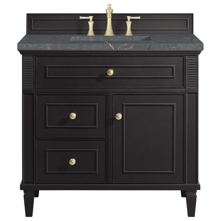 a black bathroom vanity with marble top and two faucets