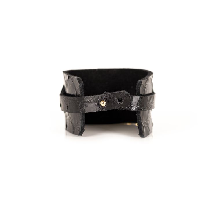 Leather bracelet made of two layers of premium black Italian leather. The Buckle Black Leather Cuff has an adjustable double-snap closure. This unique artisanal handmade cuff is a distinctive fashion statement to any wardrobe. This bracelet is a great gift for women. DETAILS 1.57" width 7" length Double Snap Closure Black Gold Plated Buckle 100% genuine Italian Leather Handmade Made in USA Chic Leather Bracelet Jewelry, Leather Double Band Bracelet With Leather Strap, Handmade Adjustable Leather Wrap Bracelet, Modern Adjustable Leather Bracelet With Wrist Strap, Adjustable Leather Wristband For Everyday, Chic Adjustable Leather Bracelet, Luxury Black Leather Jewelry, Leather Strap Cuff Bracelet For Everyday, Leather Bangle Bracelet