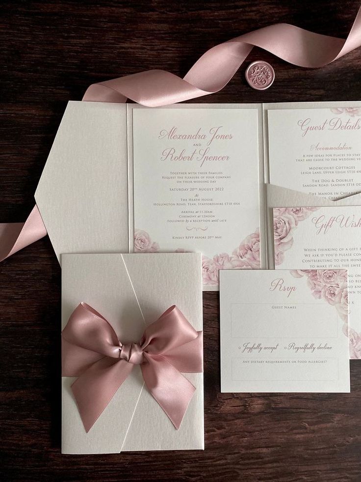 wedding stationery with pink ribbon and bow