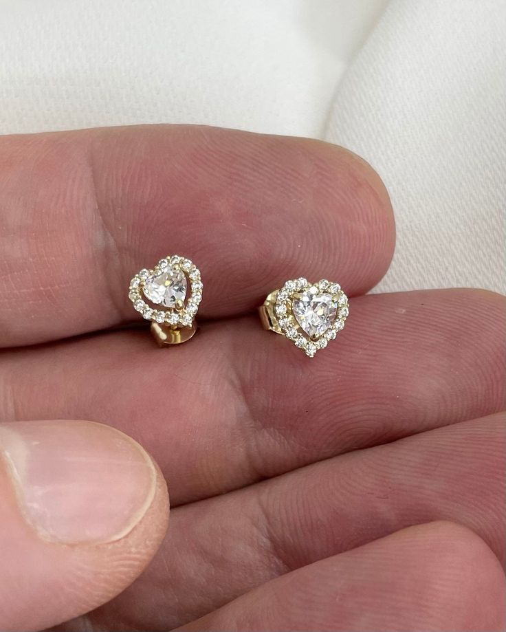 Genuine 9CT Yellow Gold Earrings - Heart CZ  and Pave Set Stud EARRINGS 375 Hallmarked - 0.75 Gram Gold Earrings - Gift Boxed Earring Material9ct Gold Weight0.75 Grams width 7.5mm high 7mm All of our jewellery is professionally inspected, All items sold are Genuine Please do not Hesitate to contact me if you require any further Information or have any problems Any issues I will ensure that they are resolved with 100% customer satisfaction Heart Cut Diamond Earrings For Gift, Heart Cut Diamond Earrings With Prong Setting As Gift, Diamond White Heart Earrings As Gift, Heart Shaped Brilliant Cut Diamond Earrings Gift, Heart Cut Earrings With Prong Setting As Gift, Heart Cut Cubic Zirconia Earrings For Gift, Heart-shaped Diamond Earrings With Vvs Clarity For Gift, Round Cut Cubic Zirconia Heart Earrings For Gift, Fine Jewelry Heart Earrings Cubic Zirconia Gift