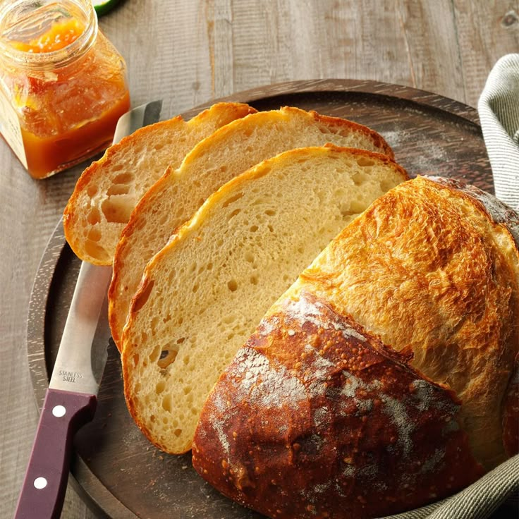 a loaf of bread sitting on top of a wooden plate