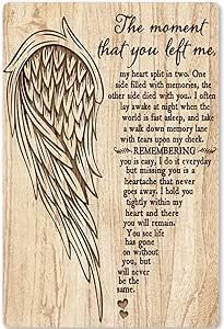 a wooden plaque with an angel's wings on it and the words, the moment that you left me