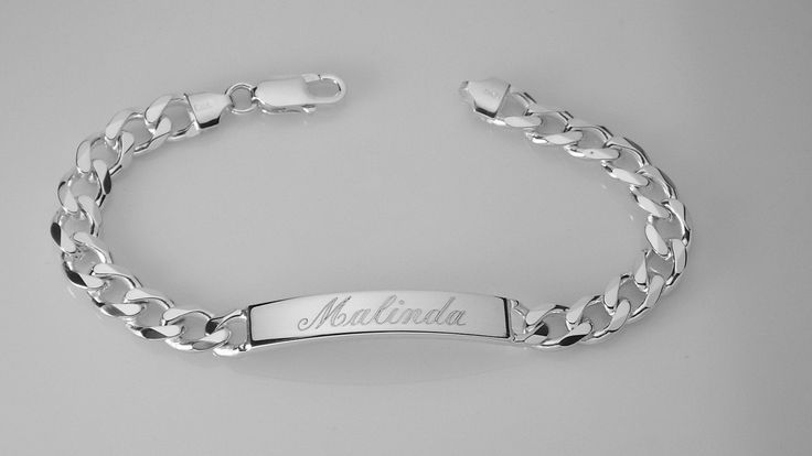 "This solid sterling silver bracelet is 8\" long and features a flat, diamond cut curb chain with a lobster claw clasp. The engravable identification plate is about 1.5\" long and a bit over .25\" wide and about 1/8\" thick. This is a heavy bracelet, weighing about 32 g. It has a high polish, shiny finish These look fabulous with a name, initials, a date or even Roman numerals. Delivered to you in a gift box. To see my current selection of bracelets: https://www.etsy.com/shop/AnniesHours?section Classic Personalized Sterling Silver Bracelets, Classic Sterling Silver Personalized Bracelet, Adjustable Curb Chain Jewelry For Formal Occasions, Formal Adjustable Curb Chain Jewelry, Elegant Personalized Curb Chain Jewelry, Adjustable Silver Bracelet With Curb Chain, Formal Sterling Silver Link Bracelet With Curb Chain, Elegant Curb Chain Jewelry For Personalized Gift, Elegant Jewelry With Curb Chain For Personalized Gift