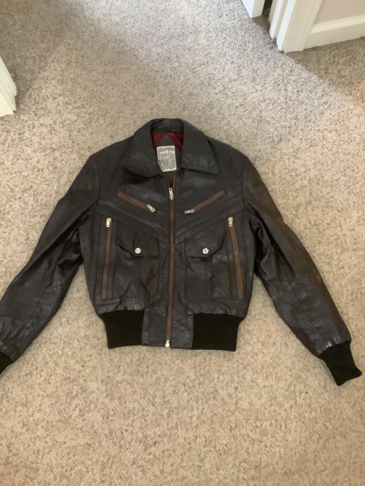 This nice vintage 70s Scott's Grey Ltd leather Motorcycle boho  age racer like brown leather patchwork design jacket comes to you in a size S-M. As you can see from pictures has zippers in front with cool snap pockets bomber like jacket with wider lapels. On the back of the jacket has like a v patchwork design to jacket- has elastic around the bottom of waist and bottom of sleeves. Leather Long Sleeve Jacket With Patchwork, Patchwork Leather Jacket With Long Sleeves, Retro Winter Biker Jacket For Outdoor, Retro Winter Biker Jacket, Retro Brown Outerwear With Zipper Closure, Fall Leather Jacket With Patchwork, Patchwork Leather Jacket For Fall, Vintage Outdoor Biker Jacket With Zipper Closure, Vintage Biker Jacket With Zipper For Outdoor