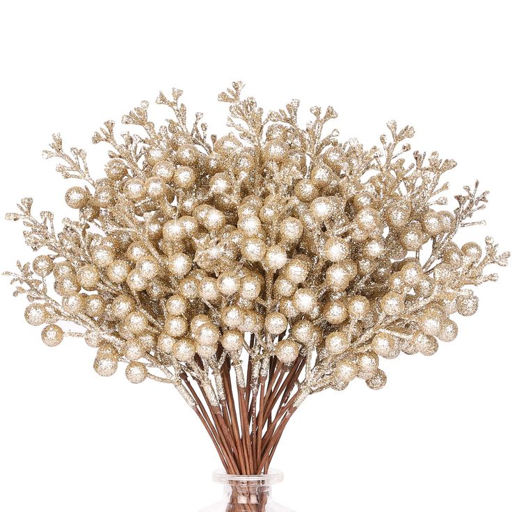 a vase filled with lots of white balls