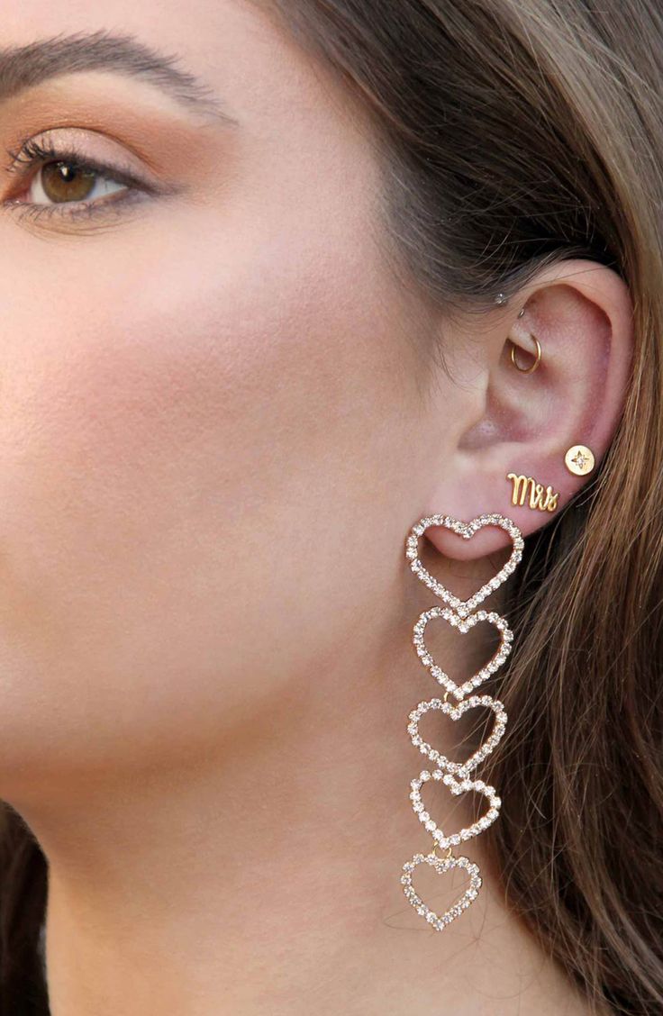 Crystal-embellished graduated heart dangle elegantly from your lobes in these stunning drop earrings goldtone plated earrings. 3 1/4" drop Post back Goldtone plate/cubic zirconia Imported Earring Stud Set, Stackable Necklaces, Sweet Earrings, Silver Heart Earrings, Chunky Earrings, Vintage Style Earrings, Earring Stud, Loop Earrings, Statement Drop Earrings