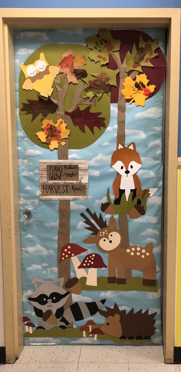 a door decorated with fall leaves and animals