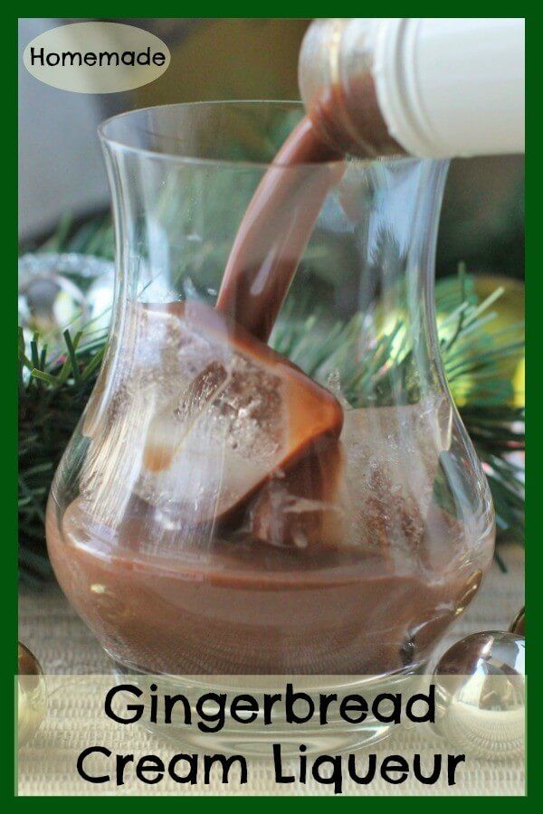 a glass pitcher filled with ice cream and chocolate syrup being poured into the jar for gingerbread creme liqueur