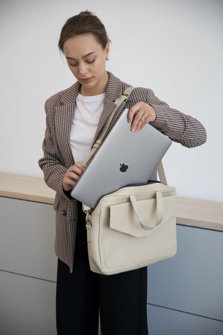 Introducing our women's leather laptop bag, the perfect blend of style and functionality. Designed specifically for women, this laptop tote bag is crafted from luxurious leather, allowing you to carry your laptop in utmost elegance.  Whether you're heading to the office or a business meeting, this leather laptop bag is a must-have accessory that combines practicality with timeless sophistication. Upgrade your professional look with our women's leather laptop bag today. Optionally, you can make c Luxury Briefcase For Business, Luxury Leather Briefcase For Gift, Versatile Business Laptop Bag Tote, Versatile Business Laptop Tote Bag, Elegant Large Capacity Laptop Bag For Everyday, Versatile Office Tote Laptop Bag, Versatile Office Briefcase With Adjustable Strap, Versatile Laptop Bag With Large Capacity For Work, Chic Large Capacity Laptop Bag For Business