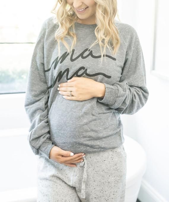 With a comfy fit and feel, this sweatshirt is perfect for all things #momlife.  Whether it’s a day full of lounging or running errands with the kiddos, she’ll be cozily sporting her favorite nickname of all, Mama!Sizing is unisex.  Intended to be a bit baggier and cozy, we recommend ordering your typical size unless you like an extra loose fit.  Raglan sleeves and a stretch collar, cuffs and hem.  Fabric is 7.2-ounce, 66/34 poly/ring spun cotton French terry. Cozy Super Soft Everyday Sweatshirt, Super Soft Fleece Sweatshirt With Relaxed Fit, Super Soft Relaxed Fit Fleece Sweatshirt, Relaxed Fit Fleece Sweatshirt, Super Soft, Super Soft Comfortable Sweatshirt With Cozy Fit, Comfy Super Soft Sweatshirt For Everyday, Super Soft Cozy Fit Comfortable Sweatshirt, Relaxed Fit Fleece Tops For Lounging, Super Soft Comfy Everyday Sweatshirt