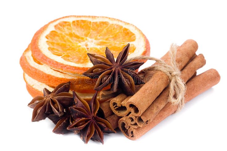 an orange, cinnamon and star anise on a white background